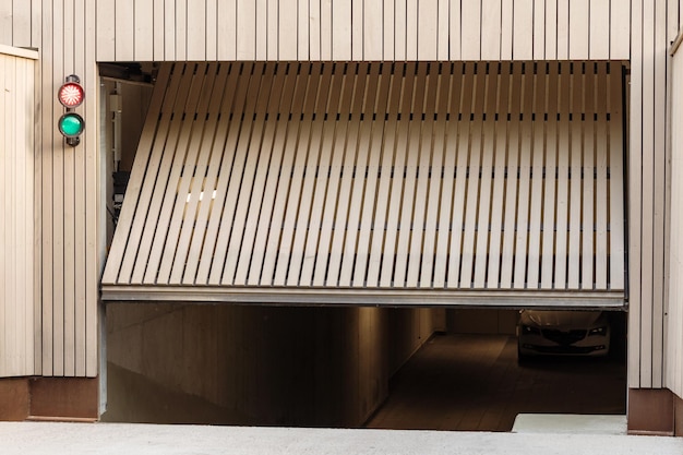 Garage Door to Car Parking. Entrance to Underground Car Parking with traffic light.