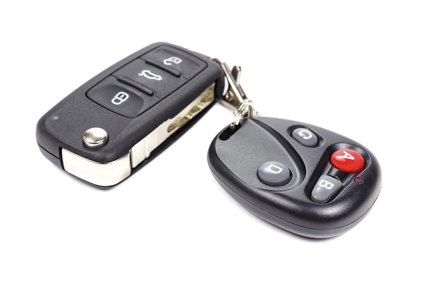 Garage door remote control with closed ignition key on white