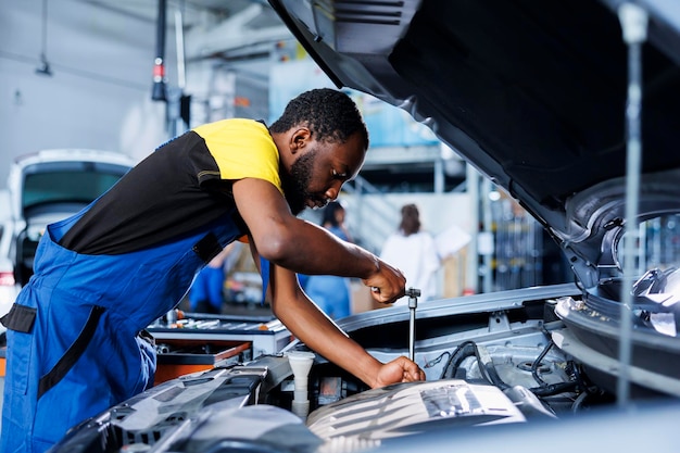 Garage specialist replaces car engine