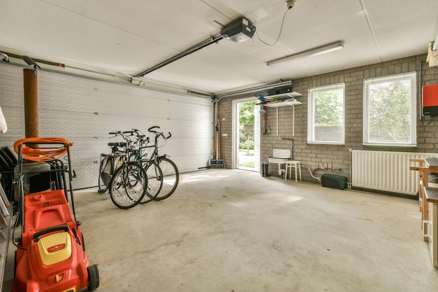 Photo a garage with bikes on the wall and a car