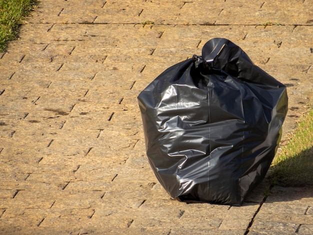 Photo garbage bag on the sidewalk for collection