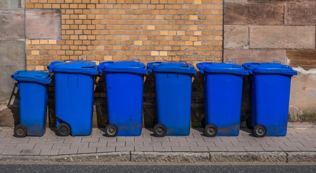 Photo garbage bin against brick wall