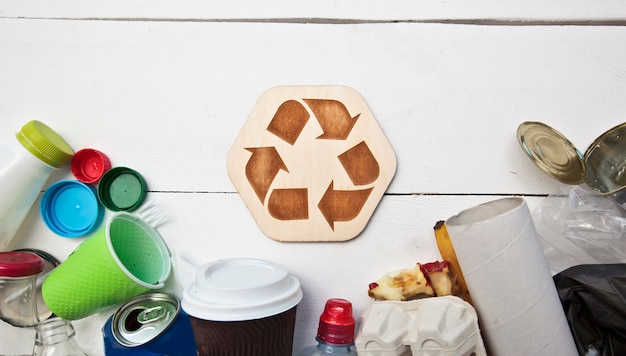 Garbage and the recycling icon on a white background