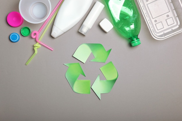 Garbage and recycling sign on a colored background top view