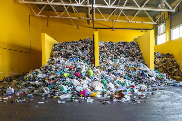 Garbage at the sorting station at the waste processing plant\
separate garbage collection recycling and storage of waste for\
further disposal business for sorting and processing of waste