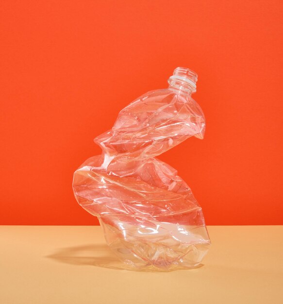 Garbage A wrinkled plastic bottle on colorful background