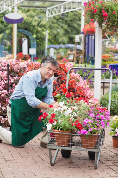 Garden center worker with trolley