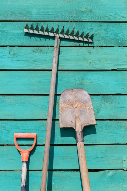 Garden instruments on wooden background