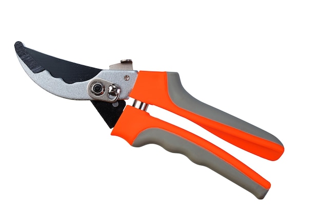 garden metal pruner with plastic orange handles insulated on a white background