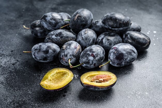 Garden plums on stone table top view