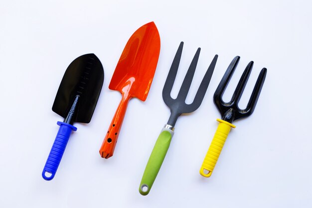 Garden shovel and fork isolated on white background