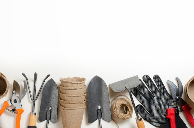 Garden tools and gloves on a white background