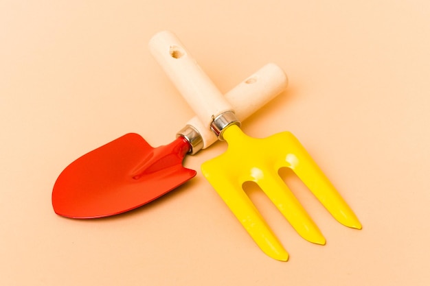 Garden tools isolated on beige background