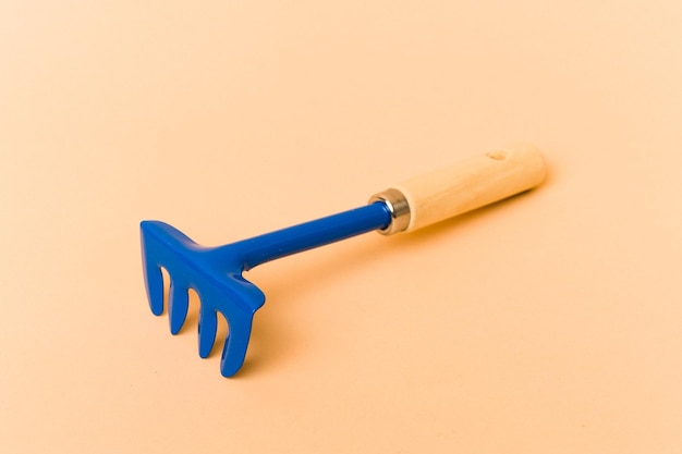 Garden tools isolated on beige background