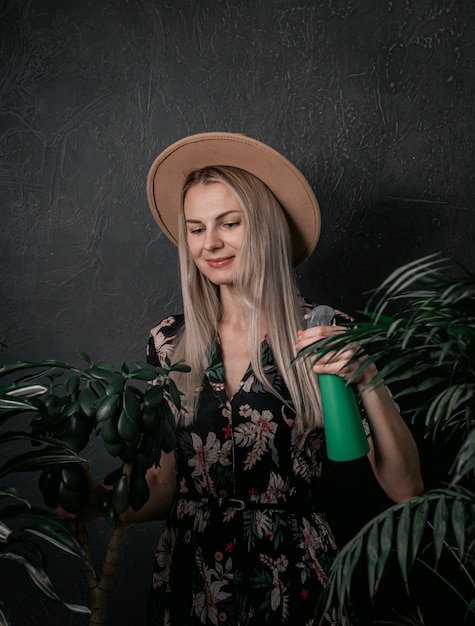 Gardener girl is engaged in her plants