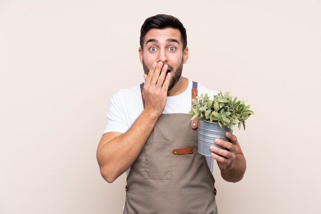 Gardener man over isolated wall