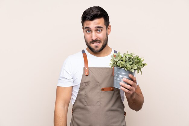 Gardener man over isolated wall