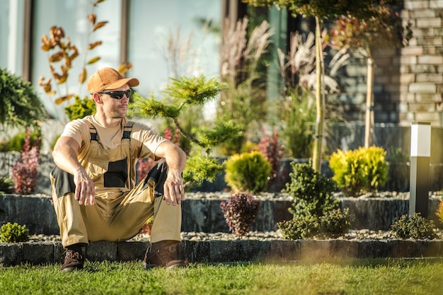 Gardener Sitting Down And Taking Break At Work