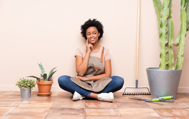 Gardener woman sitting on the floor