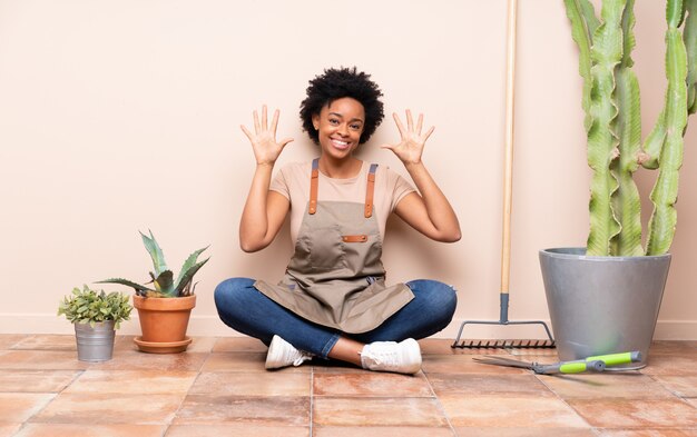 Gardener woman sitting on the floor