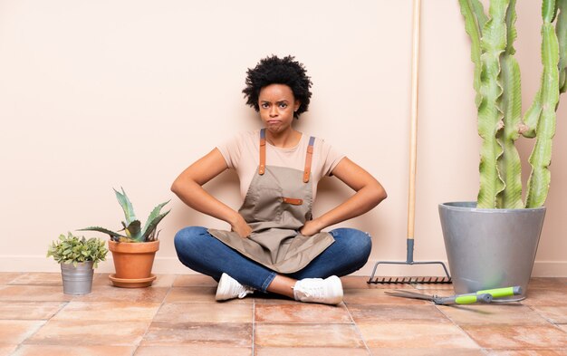 Gardener woman sitting on the floor