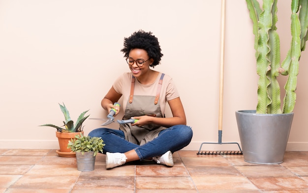 Gardener woman sitting on the floor