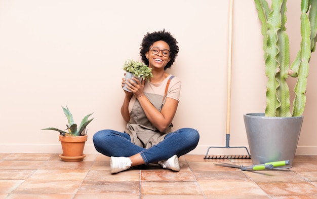 Gardener woman sitting on the floor