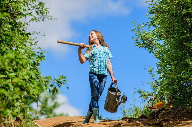 Gardening guide for beginners Gardening tips Spring gardening Girl child hold shovel watering can Spring gardening checklist Little helper Watering tools that will solve dry yard problems