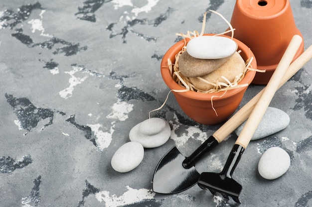 Gardening tools and clay terracotta flower pots 