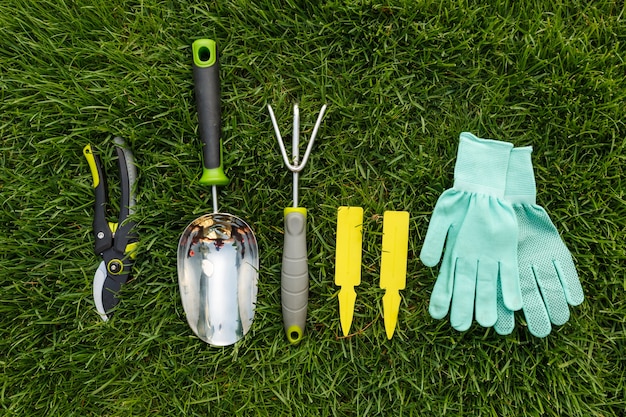 Photo gardening tools and equipment closeup in the backyard.