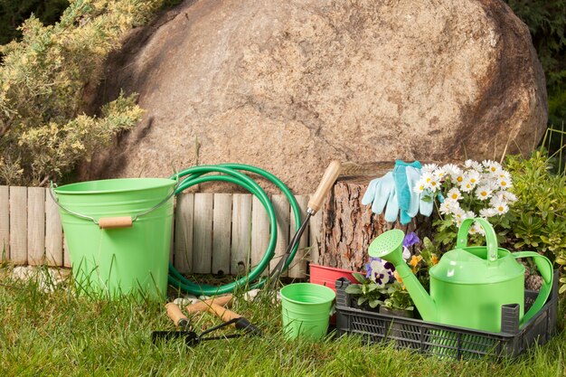 Gardening tools on the grass in the garden