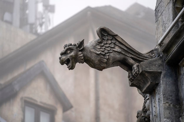 Gargoyle statue, chimeras, in the form of a medieval winged monster