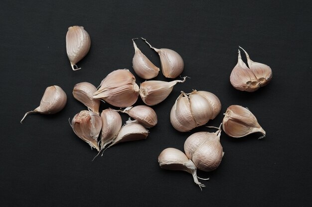 Garlic on black isolated background close up