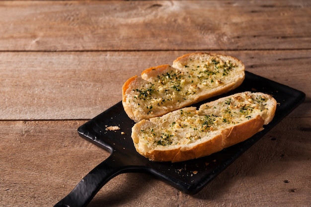 Garlic Bread on Black Plate