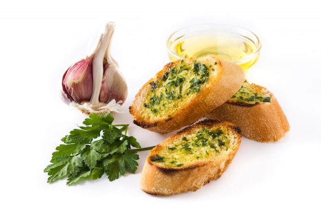 Garlic breads slice and ingredients isolated on white