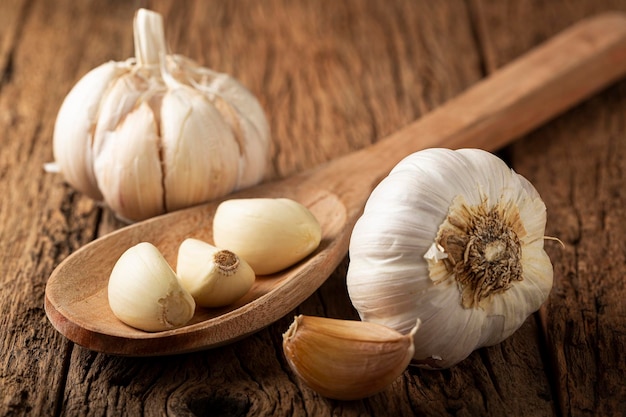 Garlic bulb and garlic cloves on the wooden table