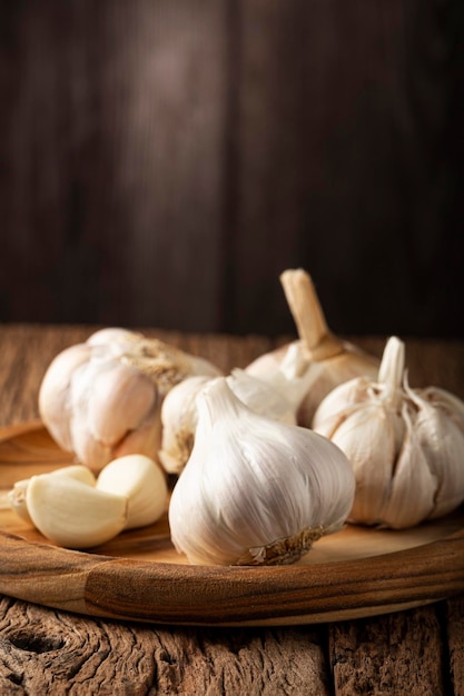 Garlic bulb and garlic cloves on the wooden table