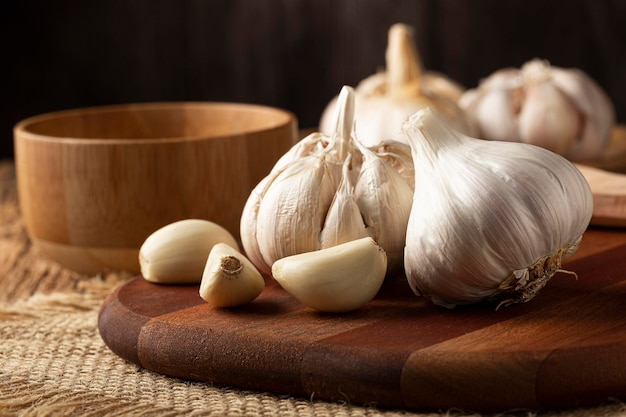 Garlic bulb and garlic cloves on the wooden table