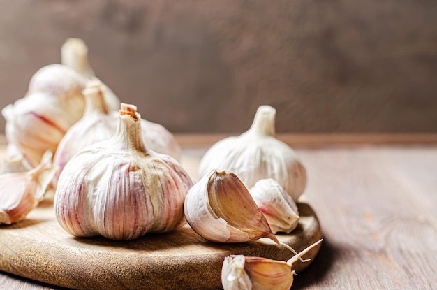 Garlic bulbs on a wooden background Copy space