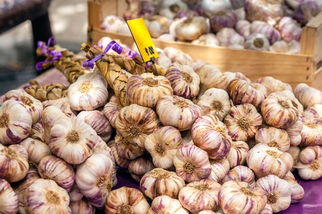 Garlic bunches in a farmers market. Shot with a selective focus