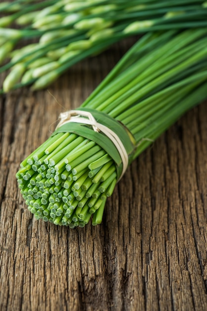 Garlic chives on wood