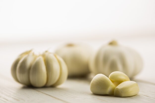 Garlic cloves and bulb on chopping board