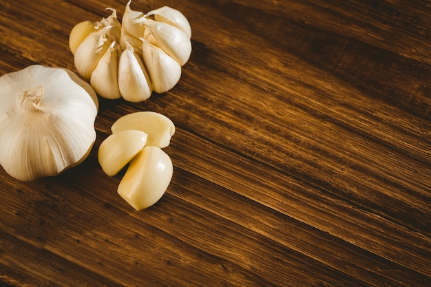 Garlic cloves and bulb on chopping board