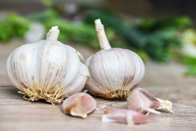 Garlic Cloves and fresh garlic bulb on wooden forherbs and spices ingredients spicy food