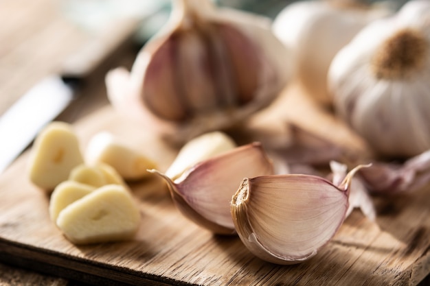 Garlic cloves on rustic wooden table