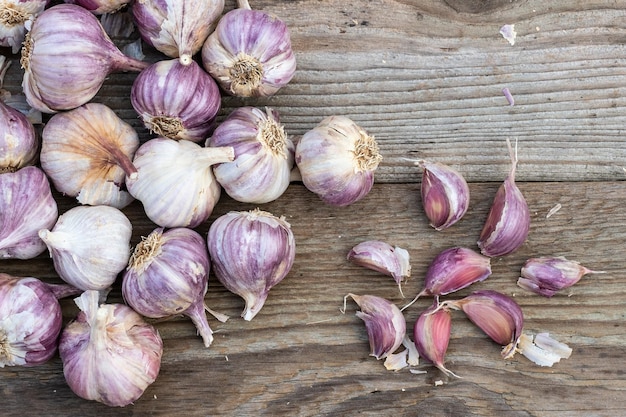 Garlic cloves on wooden vintage background Seedlings for planting garlic