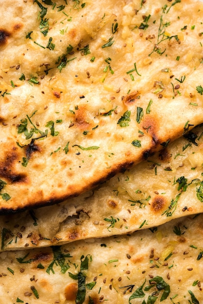 Garlic and coriander naan served in a plate, it's a type of Indian bread or roti flavoured with Lahsun