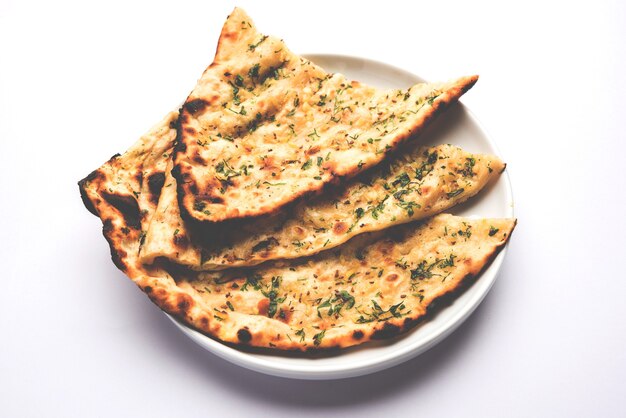 Garlic and coriander naan served in a plate, it's a type of Indian bread or roti flavoured with Lahsun