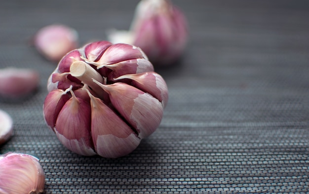 Garlic. Fresh Garlic. Cloves of garlic on black background