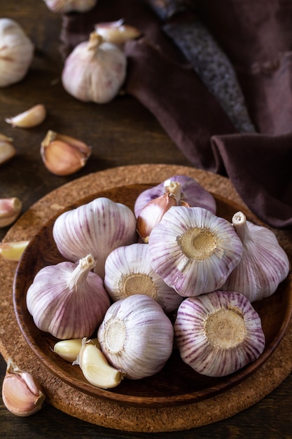 Garlic Garlic Cloves and Bulb on rustic wooden table